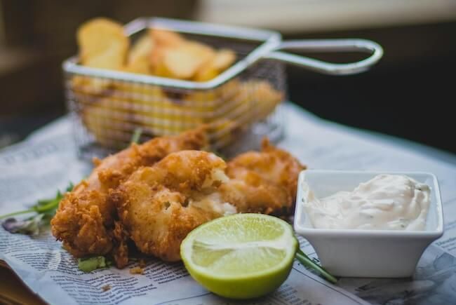 Bowl of sauce and spoon on table